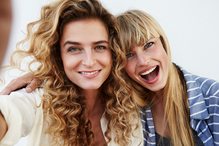 Two women smiling towards the camera