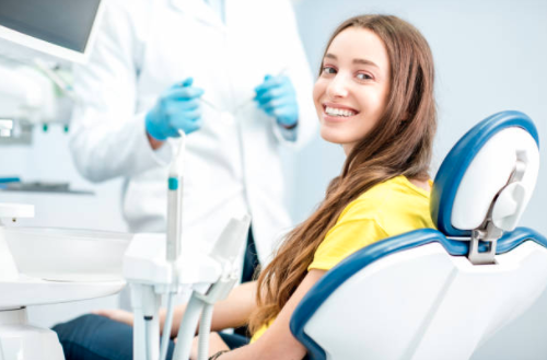 Woman smiling at her dentist appointment