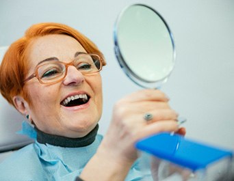 Pleasanton patient smiling with new dental implantsfile