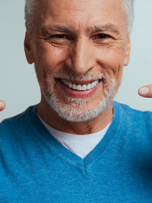 A smiling man with dentures