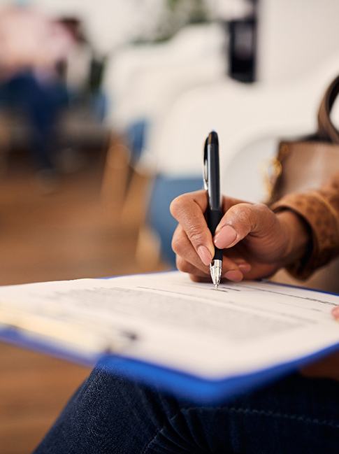 Patient filling out paperwork in lobby